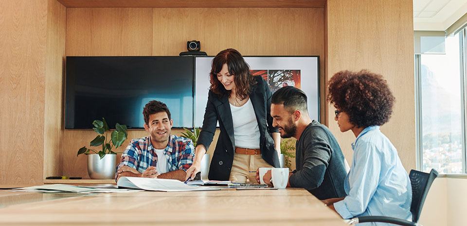 Multi ethnic business people meeting in conference room.